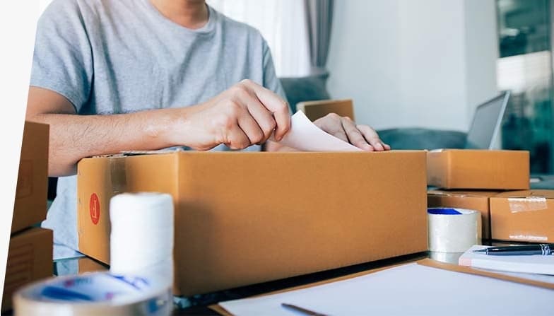 A parcel being packed for posting